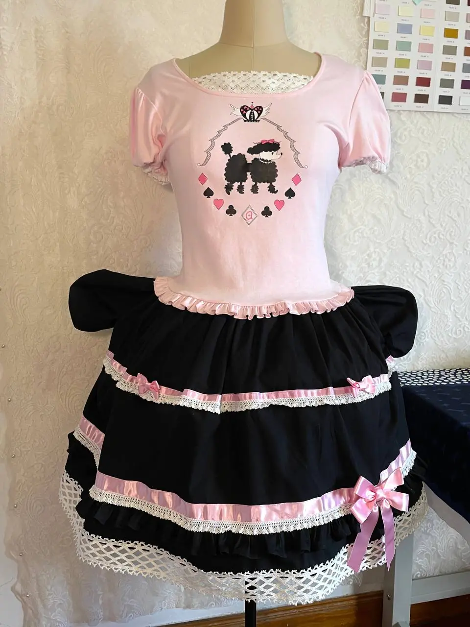 Poodle Poker — pink and black, from the side
